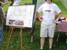 Barb letting festival goers know about our new building and its floor plan